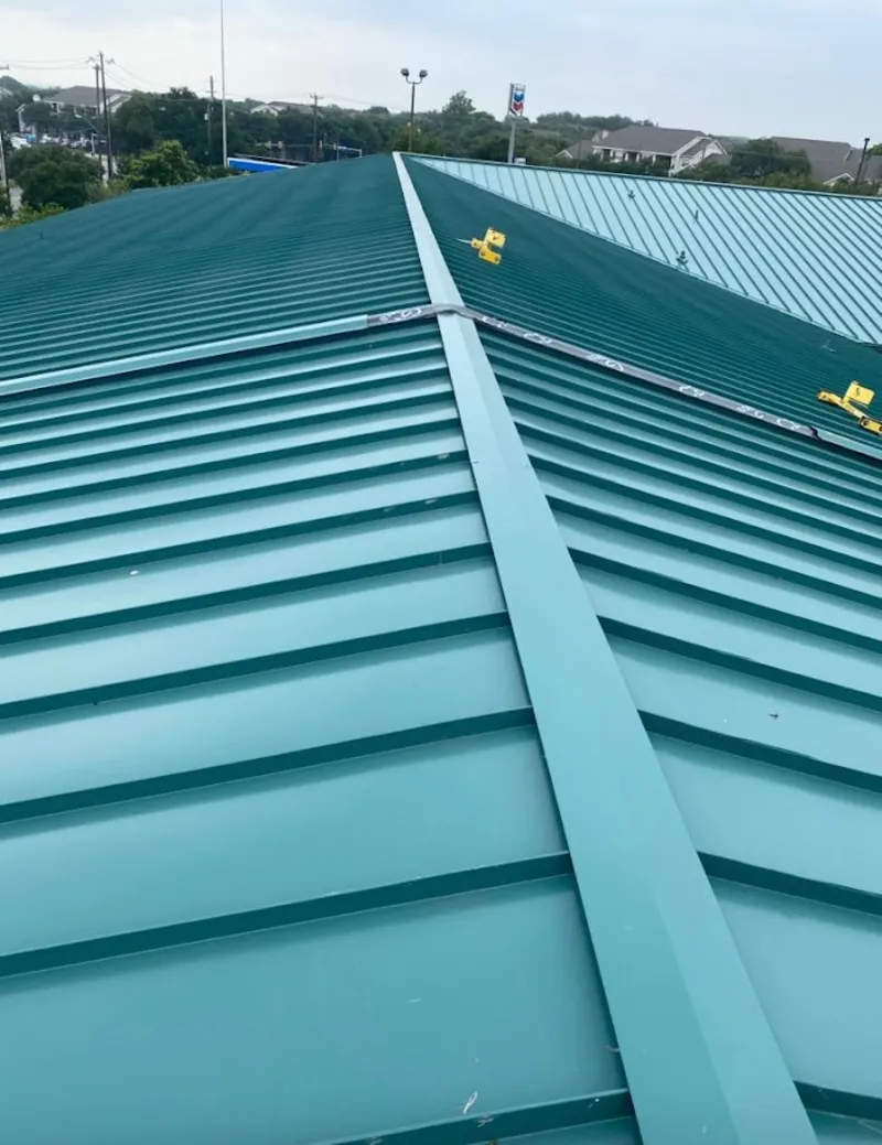 Green commercial metal roof ridge and valley for Metal Roof Repair in Innsbrook