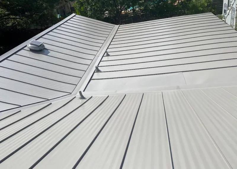 Solar attic fan installed on a metal roof for Roof Ventilation in Innsbrook